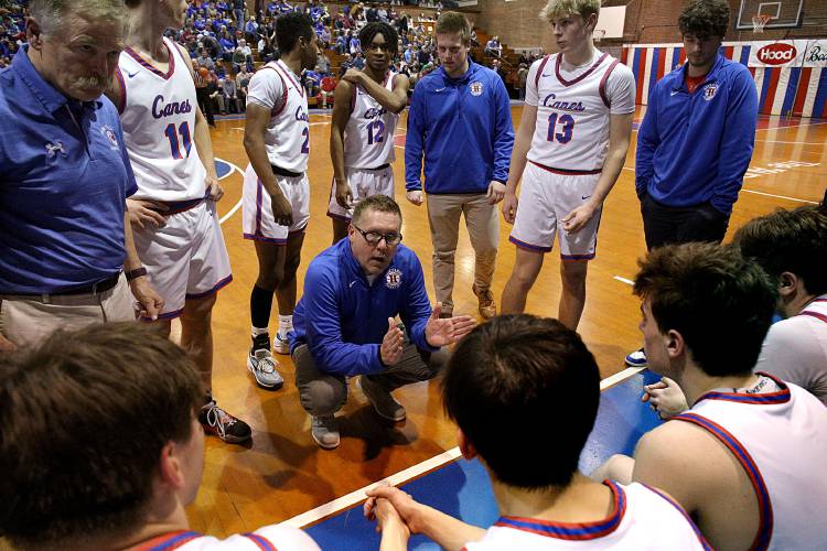 Hartford head coach Mike Gaudette talks strategy with his team during a time out against North Country in the VPA D-II semifinal in Barre, Vt., on Feb. 24, 2024. Hartford won, 66-48, advancing to Saturday’s title game. (Valley News - Geoff Hansen) Copyright Valley News. May not be reprinted or used online without permission. Send requests to permission@vnews.com.