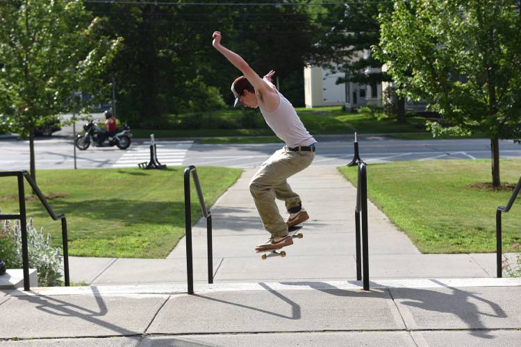 Gabe Limlaw, 15, of Corinth, Vt., skateboards near the Bradford Academy building in Bradford, Vt., on Friday, June, 30, 2023. Limlaw serves on a subcommittee to fundraise for a skatepark in Bradford. (Valley News - Jennifer Hauck) Copyright Valley News. May not be reprinted or used online without permission. Send requests to permission@vnews.com.