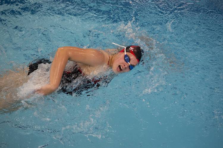 Stevens’ Aubree Herzog competes in the girls 100-yard freestyle during a swim meet hosted at the CCBA Witherell Recreation Center in Lebanon, N.H., on Tuesday, Dec. 5, 2023. (Valley News / Report For America - Alex Driehaus) Copyright Valley News. May not be reprinted or used online without permission. Send requests to permission@vnews.com.