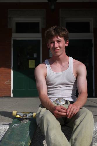 Gabe Limlaw, 15, is a skateboarder who lives in Corinth, Vt., and serves on a subcommittee to fundraise for a skatepark in Bradford, Vt. He occasionally skateboards in town including in front of the Bradford Academy building on Friday, June, 30, 2023. (Valley News - Jennifer Hauck) Copyright Valley News. May not be reprinted or used online without permission. Send requests to permission@vnews.com.
