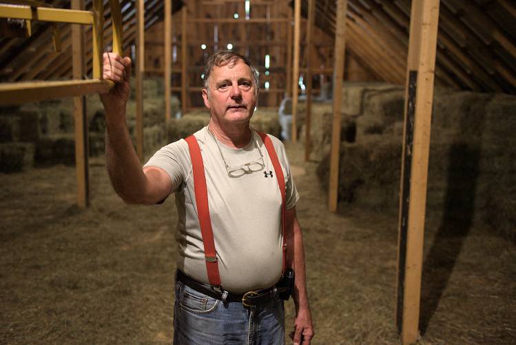 Due to wet weather this summer, Chip Kendall has only put up 325 bales of hay for horse feed at his Kedron Valley Stables in South Woodstock, Vt., on Tuesday, August 8, 2023, at a time when he usually would have made 2,000 bales toward an annual goal of 5,000. He feeds out 14 to 16 bales a day and is looking into buying hay from a supplier in New York. (Valley News - James M. Patterson) Copyright Valley News. May not be reprinted or used online without permission. Send requests to permission@vnews.com.