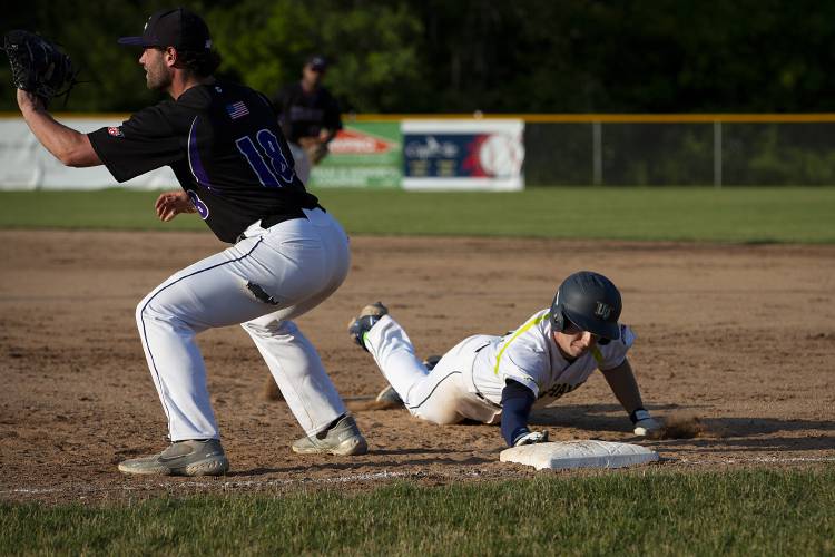 Upper Valley Nighthawks’ Stephen Harrington (34) slides back to first base as Keene Swamp Bats’ Garrett Rice (18) waits to catch the ball and attempt to tag him out during a game at Maxfield Sports Complex in White River Junction, Vt., on Wednesday, June 21, 2023. The Nighthawks won, 5-3. (Valley News / Report For America - Alex Driehaus) Copyright Valley News. May not be reprinted or used online without permission. Send requests to permission@vnews.com.