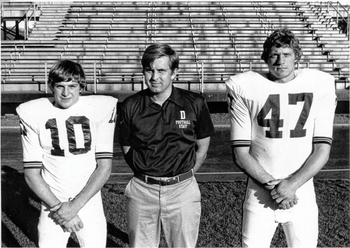 Buddy Teevens, left, and Joe Nastri, right, flank Dartmouth College freshman football coach Wayne Donner during the 1975 season. The pair captained the freshman team and later the varsity as seniors, when they helped the Big Green win the Ivy League title.