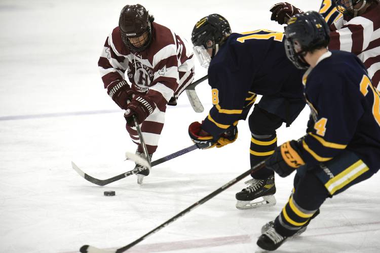 Hanover's Mateo Trimble moves past Bow's Will Raisty and Massimo Palelli during their game on Wednesday, Dec. 20, 2023, in West Lebanon, N.H. Trimble had two assists in Hanover's 5-2 loss. (Valley News - Jennifer Hauck) Copyright Valley News. May not be reprinted or used online without permission. Send requests to permission@vnews.com.
