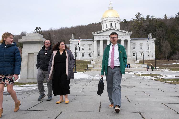 Hudson Ranney, 15, of Windsor, right, leaves the Vermont State House in Montpelier, Vt., on Tuesday, Feb. 21, 2023, with his family, from left, sister Natalie, 12, dad Adam, and mom Katie, after testifying in support of H. 259. The bill would require school boards in Vermont to add two non-voting student members. (Valley News - James M. Patterson) Copyright Valley News. May not be reprinted or used online without permission. Send requests to permission@vnews.com.
