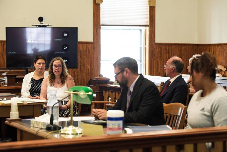 Amy Cruz, second from left, addresses Victoria Griffin, far right, in a statement at Griffin's sentencing for the killing of her former husband, Concepcion Cruz, in Orange Superior Court in Chelsea, Vt., on Friday, July 7, 2023. Amy Cruz was joined at the prosecution's table by victim advocate Kelly Doyle, left. Also pictured are defense attorney Michael Shane, center, and Acting State's Attorney Colin Seaman, second from right. (Valley News - James M. Patterson) Copyright Valley News. May not be reprinted or used online without permission. Send requests to permission@vnews.com.
