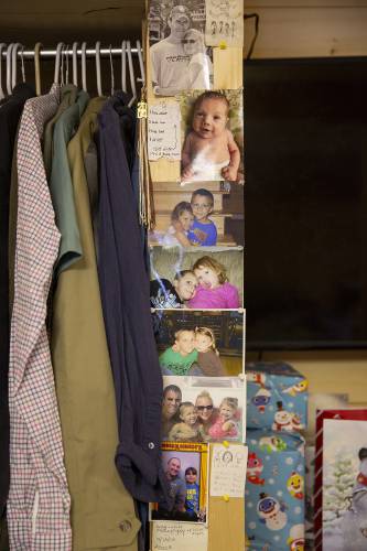Family photos salvaged from Casey Mispel’s dresser, which was badly damaged by floodwater, are pinned to the wall at the Mispels’ home in Bridgewater, Vt., on Wednesday, Dec. 20, 2023. Nathan Mispel said that the ordeal his family experienced over the summer sometimes feels like a bad dream. “It’s hard to believe it happened,” he said. (Valley News / Report For America - Alex Driehaus) Copyright Valley News. May not be reprinted or used online without permission. Send requests to permission@vnews.com.