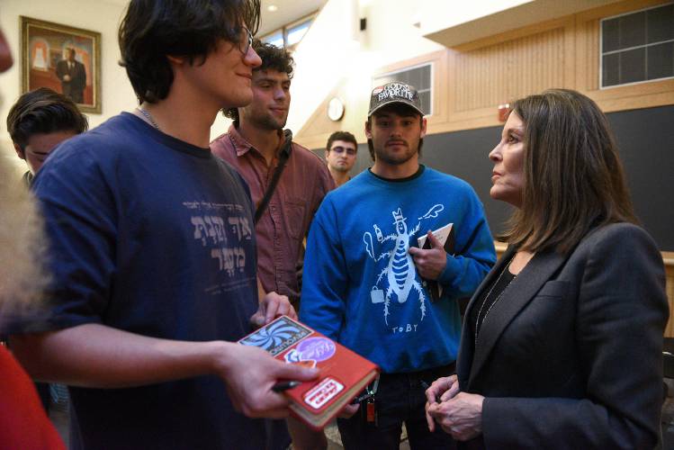 Marianne Williamson, a Democratic candidate for president, speaks with Dartmouth College students Ari Garnick, left, Tommy Bevevino and Toby Choyt after her talk at the school's Rockefeller Center on Tuesday, Oct. 3, 2023, in Hanover, N.H. (Valley News - Jennifer Hauck) Copyright Valley News. May not be reprinted or used online without permission. Send requests to permission@vnews.com.