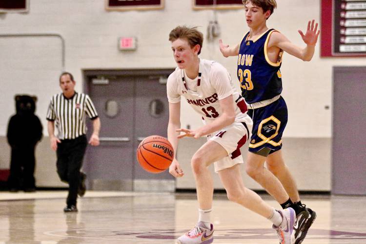 Hanover High's Ryan McLaughlin (13), shown against Bow on January 10, 2023, is considered a college prospect at guard. The son of Dartmouth College men's basketball coach David McLaughlin plays extensively outside of the high school season. 