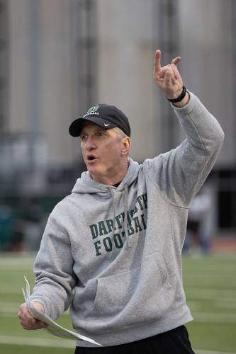 Dartmouth Acting Head Coach Sammy McCorkle instructs players before a drill during the first spring football practice of the year at Memorial Field in Hanover, N.H., on Tuesday, April 4, 2023. (Valley News / Report For America - Alex Driehaus) Copyright Valley News. May not be reprinted or used online without permission. Send requests to permission@vnews.com.