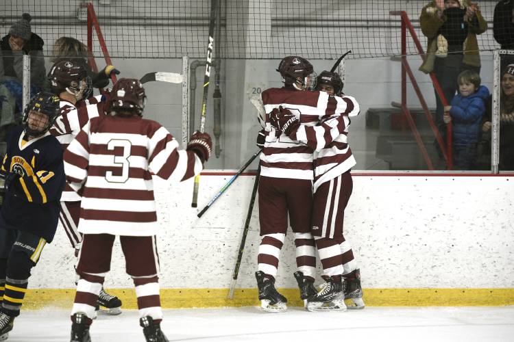Hanover captains Jack Wilkinson, left, and Wyatt Seelig celebrate Seelig's goal during their game with Bow on Wednesday, Dec. 20, 2023, in West Lebanon, N.H. Bow won, 5-2. (Valley News - Jennifer Hauck) Copyright Valley News. May not be reprinted or used online without permission. Send requests to permission@vnews.com.