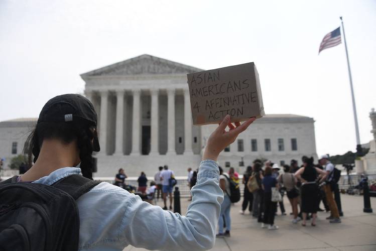 Affirmative action supporters demonstrate outside the US Supreme Court in Washington, DC, on June 30, 2023. The court on June 29 banned the use of race and ethnicity in university admissions, dealing a major blow to a decades-old practice that boosted educational opportunities for African-Americans and other minorities. (Olivier Douliery/AFP via Getty Images/TNS)