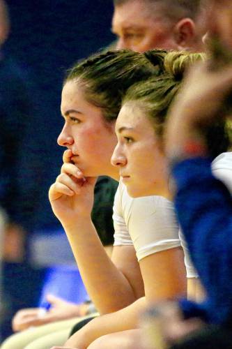 Hartford High's Madison Willey, left, and Izzy Sirois, watch the closing minutes of their team's 71-22 defeat of Otter Valley on Jan. 26, 2024, in White River Junction, Vt. Willey had 10 points to help the Hurricanes improve to 8-2. (Valley News - Tris Wykes) Copyright Valley News. May not be reprinted or used online without permission.