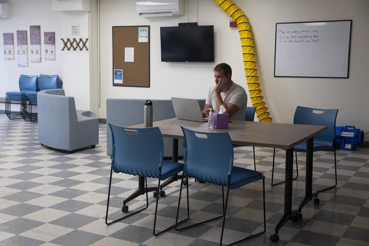 Dan Wargo, director of recovery programs, works at the new TLC Recovery Center in Lebanon, N.H., on Tuesday, Oct. 10, 2023. The center is open for drop-ins from 10 a.m. to 4 p.m., Monday through Friday, and offers individual guidance for accessing resources and navigating addiction recovery. Wargo said he expects the center’s offerings to expand as the staff learns about the needs and wants of the community. “I want it to create itself,” he said. (Valley News / Report For America - Alex Driehaus) Copyright Valley News. May not be reprinted or used online without permission. Send requests to permission@vnews.com.