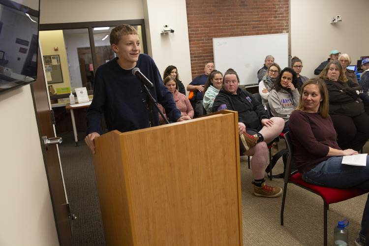 Eighth-grader Mason Day, 14, of White River Junction, Vt., reads a letter he wrote to former interim principal Justin Bouvier, thanking him for helping him to feel safe and motivated in school, during a Hartford School Board meeting at Hartford Town Hall in White River Junction, Vt., on Wednesday, Dec. 13, 2023. (Valley News / Report For America - Alex Driehaus) Copyright Valley News. May not be reprinted or used online without permission. Send requests to permission@vnews.com.