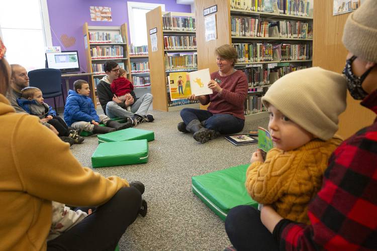 Youth Services Librarian Amy VanderKooi, center, reads “What Pete Ate from A to Z” during story time at the Hartland Public Library in Hartland, Vt., on Saturday, Jan. 20, 2024. (Valley News / Report For America - Alex Driehaus) Copyright Valley News. May not be reprinted or used online without permission. Send requests to permission@vnews.com.