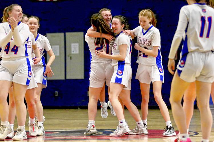 Hartford High's Madison Willey (21) lifts Kamryn Brower in a hug after Brower banked in a three-point shot as the first half expired on Jan. 26, 2024, in White River Valley, Vt. The Hurricanes defeated Otter Valley, 71-22. (Valley News - Tris Wykes) Copyright Valley News. May not be reprinted or used online without permission.