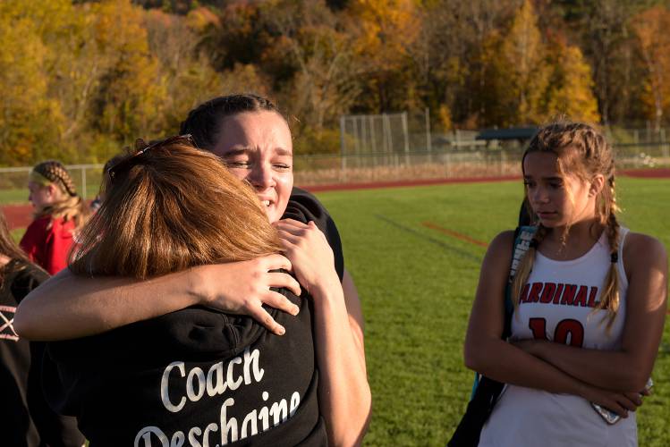 Jill Ouellette hugs Mascoma field hockey Head Coach Patty Deschaine, left, after their Division III tournament loss to Mascoma in Claremont, N.H., on Tuesday, Oct. 18, 2022. Deschaine announced her retirement after the game. (Valley News - James M. Patterson) Copyright Valley News. May not be reprinted or used online without permission. Send requests to permission@vnews.com.