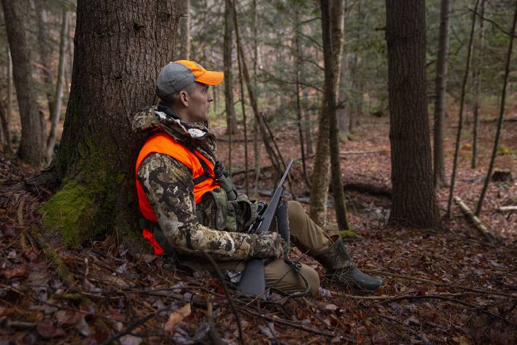 Martin Philip, of White River Junction, Vt., watches for deer while hunting in Norwich, Vt., on Saturday, Nov. 18, 2023. Philip participates in both archery and rifle seasons, and primarily hunts on friends’ land where he has permission. (Valley News / Report For America - Alex Driehaus) Copyright Valley News. May not be reprinted or used online without permission. Send requests to permission@vnews.com.