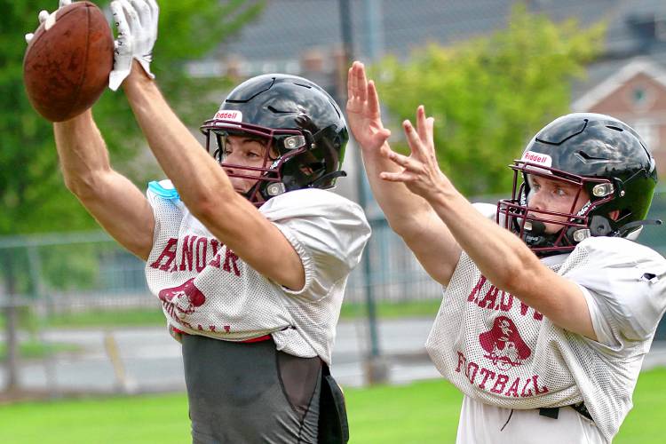 Hanover High’s David Frechette, left, and Ryan O’Hern battle for the football during their team’s Aug. 21, 2023, practice in Hanover, N.H. (Valley News - Tris Wykes) Copyright Valley News. May not be reprinted or used online without permission. Send requests to permission@vnews.com.