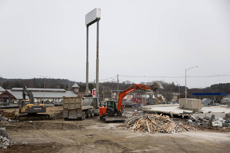 A crew works to demolish the former Kleen laundromat and dry cleaners building on Route 12A in West Lebanon, N.H., on Thursday, Feb. 22, 2024. Irving plans to develop the site, along with the adjacent parcel where a defunct Irving gas station was demolished in November 2023, to make way for a new convenience store and gas station. (Valley News / Report For America - Alex Driehaus) Copyright Valley News. May not be reprinted or used online without permission. Send requests to permission@vnews.com.