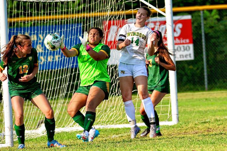 White River Valley High goalkeeper Imari Taylor plays a Windsor corner kick along with teammates Cassie Armstrong (12) and Tanner Drury (3) and Yellowjacket Olivia MacLeay (14) during the Vermont Division III teams' Sept. 1, 2023, game in South Royralton, Vt. Windsor won, 6-3. (Valley News - Tris Wykes) Copyright Valley News. May not be reprinted or used online without permission. Send requests to permission@vnews.com.