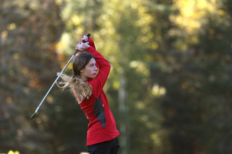 Stevens' Elli Girard watches her ball while teeing off from the first hole during a match at Eastman Golf Links in Grantham, N.H. on Thursday, Sept. 29, 2022. Stevens competed with Lebanon, Coe-Brown and Souhegan. (Valley News - Jennifer Hauck) Copyright Valley News. May not be reprinted or used online without permission. Send requests to permission@vnews.com.
