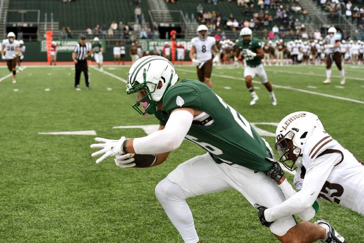 Dartmouth's Chris Corbo gets a few more steps with Lehigh's Donovan Lassiter bringing him down during their game on Saturday, Sept. 23, 2023, in Hanover, N.H. Dartmouth won 34-17. (Valley News - Jennifer Hauck) Copyright Valley News. May not be reprinted or used online without permission. Send requests to permission@vnews.com.