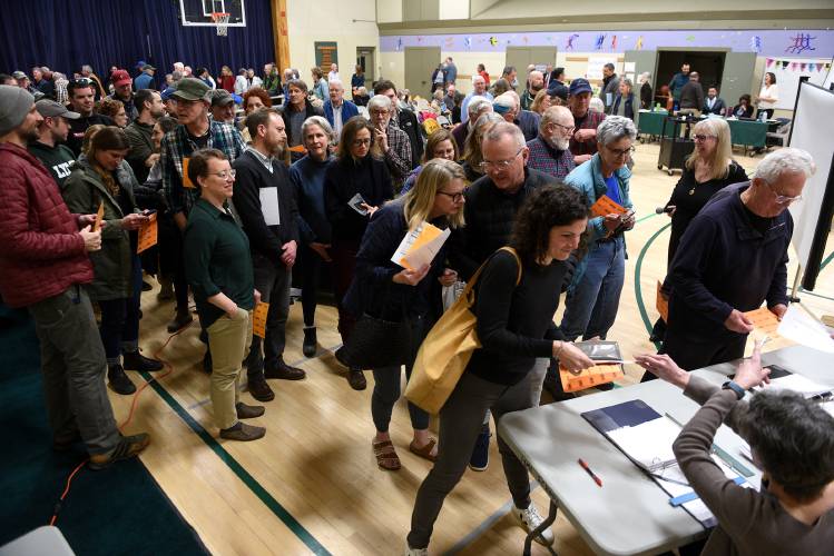Lyme residents line up to vote at the School Meeting for a $2.6 million dollar construction bond on Thursday, March 8, 2024, in Lyme, N.H. (Valley News - Jennifer Hauck) Copyright Valley News. May not be reprinted or used online without permission. Send requests to permission@vnews.com.