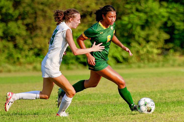Windsor High's Kenzie Wescott, left, and Amara Calhum-Flowers pursue the ball during their Vermont Division III teams' Sept. 1, 2023, game in South Royalton, Vt. Windsor won, 6-3. (Valley News - Tris Wykes) Copyright Valley News. May not be reprinted or used online without permission. Send requests to permission@vnews.com.