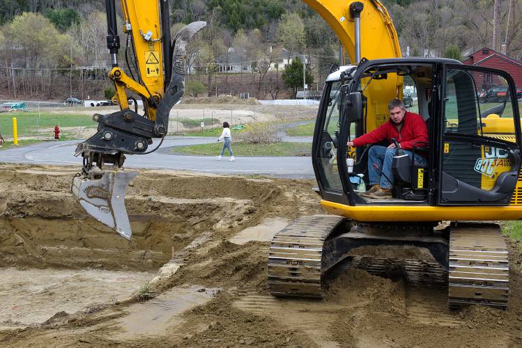 Matt Potter, of White River Junction, prepares the site for a home on the Crafts Avenue cul de sac, part of the River Park development, in West Lebanon, N.H., on Wednesday, April 19, 2023. All of the lots on the circle have been purchased and six homes are yet to be built. (Valley News - James M. Patterson) Copyright Valley News. May not be reprinted or used online without permission. Send requests to permission@vnews.com.