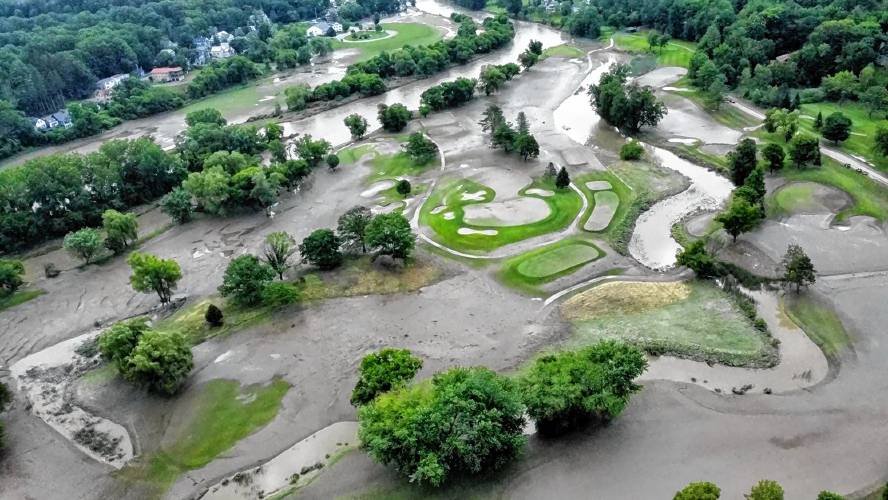 Following Monday's rains, the Ottauquechee River in Quechee, Vt., overflowed its banks and flooded the Quechee Club course, shown in a drone photograph on July 11, 2023. (Judson Dunne photograph)