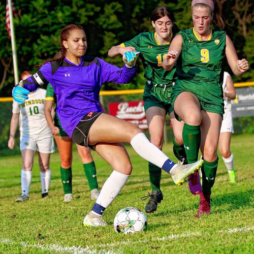 Windsor High goalkeeper Sophia Rockwood kicks over the ball while pressured by White River Valley's Norah Harwood (9) and Makenzie Vesper on Sept. 1, 2023, in South Royalton, Vt. Windsor won the Vermont Division III contest, 6-3. (Valley News - Tris Wykes) Copyright Valley News. May not be reprinted or used online without permission. Send requests to permission@vnews.com.