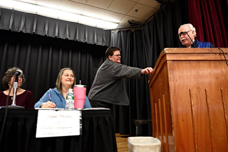 Bradford Town Treasurer Jennifer Rivers hands Moderator Peter Mallary his gavel after running to get it for the start of the Bradford Town Meeting on Tuesday, March, 5, 2019 in Bradford, Vt. Town Clerk Sonya McLam, left, and assistant clerk Jesse Meyer watch. (Valley News - Jennifer Hauck) Copyright Valley News. May not be reprinted or used online without permission. Send requests to permission@vnews.com.