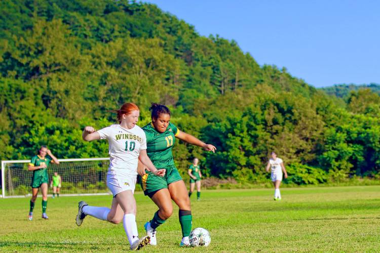Windsor High's Cassie Clark (10) and White River Valley's Imari Taylor go shoulder-to-shoulder during their Vermont Division III teams' Sept. 1, 2023, game in South Royalton, Vt. Windsor won, 6-3. (Valley News - Tris Wykes) Copyright Valley News. May not be reprinted or used online without permission. Send requests to permission@vnews.com.
