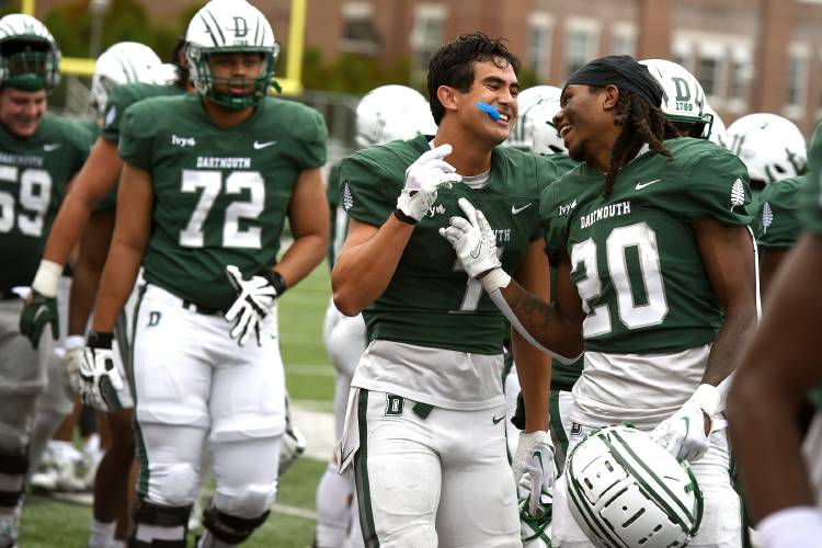 Dartmouth's Paxton Scott, left, and Q Jones celebrate a Dartmouth touchdown in the third quarter of their game with Lehigh on Saturday, Sept. 23, 2023 in Hanover, N.H. Dartmouth won 34-17.(Valley News - Jennifer Hauck) Copyright Valley News. May not be reprinted or used online without permission. Send requests to permission@vnews.com.
