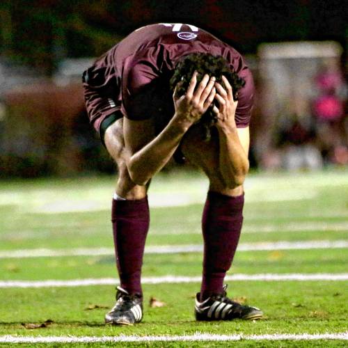 Lebanon High's Domenico Pentella bends over in anguish after missing a scoring chance during his team's 2-1 loss to Bow in the NHIAA Division II finals on Nov. 4, 2023, at Stellos Stadium in Nashua, N.H. (Valley News - Tris Wykes) Copyright Valley News. May not be reprinted or used online without permission. Send requests to permission@vnews.com.