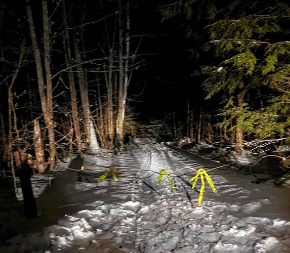 The operator of the snowmobile was thrown from the vehicle when he unknowingly drove into a cable across a road on private property in Canaan, according to the New Hampshire Fish and Game Department. (New Hampshire Fish and Game Department photograph)