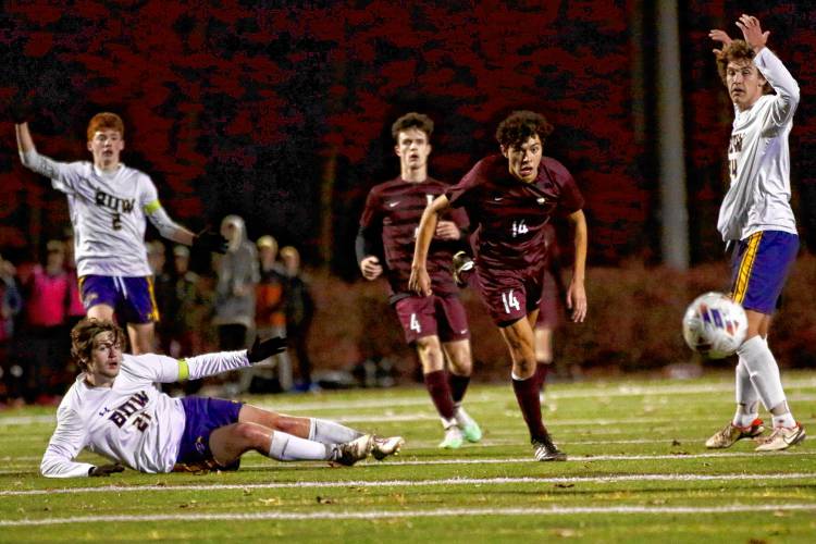 Lebanon High's Domenico Pentella (14) and Nick Brill (4) watch the ball bounce past during their team's 2-1 loss to Bow in the NHIAA Division II title game on Nov. 3, 2023, at Stellos Stadium in Nashua, N.H. The Falcons' Brodie O'Neil (21), Colby Smith (2) and Keenan Hubbard (24) shout for the referee to call offsides. (Valley News - Tris Wykes) Copyright Valley News. May not be reprinted or used online without permission. Send requests to permission@vnews.com.