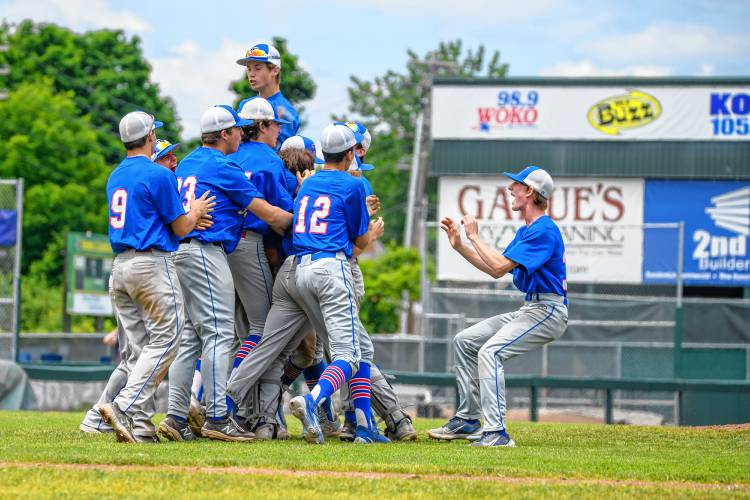 Thetford players converge in a group hug after winning the D-III championship over White River Valley Saturday at Burlington's Centennial Field. (Tim Calabro / White River Valley Herald)