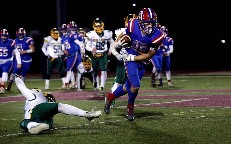 Hartford’s Brody Tyburski blows by a Burr & Burton defender to score with 8:14 remaining in their Division I state championship game in Rutland, Vt., on Nov. 11, 2023. The Hurricanes rallied to score 22 fourth-quarter points, tying the game but falling short to the Bulldogs, 35-28. (Valley News - Geoff Hansen) Copyright Valley News. May not be reprinted or used online without permission. Send requests to permission@vnews.com.