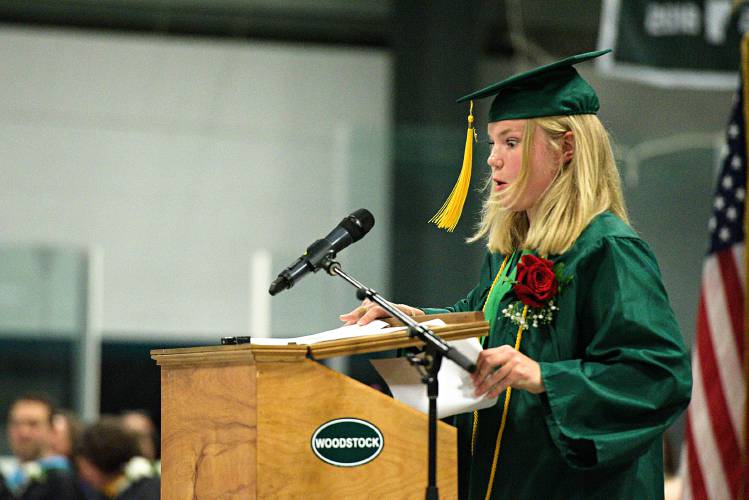 Woodstock Union High School Valedictorian Isabel Konijnenberg discovers a missing page of her speech inside the podium during commencement at Union Arena in Woodstock, Vt., on Friday, June 9, 2023. (Valley News - James M. Patterson) Copyright Valley News. May not be reprinted or used online without permission. Send requests to permission@vnews.com.