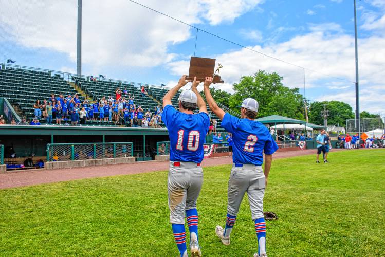 Thetford's seniors, Nolan Pepe and Jacob Gilman carry the D-III baseball title trophy after the Panthers' win over White River Valley on Saturday in Burlington. (Tim Calabro / White River Valley Herald)