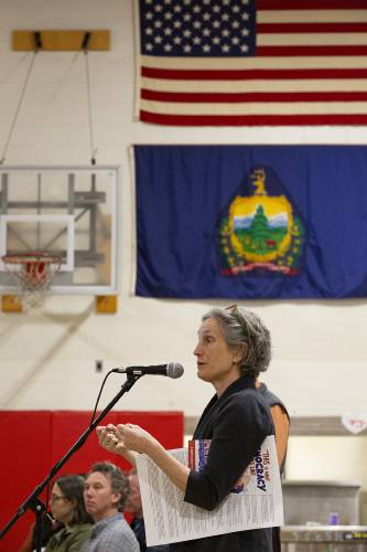 Vermont State Representative Rebecca Holcombe speaks to voters about the issues the state has faced with Act 127, likening the situation to agreeing to split the bill at a restaurant and saying that tax caps incentivized some towns to “order lobster,” during the Annual School Meeting at Sharon Elementary School in Sharon, Vt., on Monday, March 4, 2024. “We’re not done,” Holcombe said of the continuing changes that the state will be making to its school funding formula. (Valley News / Report For America - Alex Driehaus) Copyright Valley News. May not be reprinted or used online without permission. Send requests to permission@vnews.com.